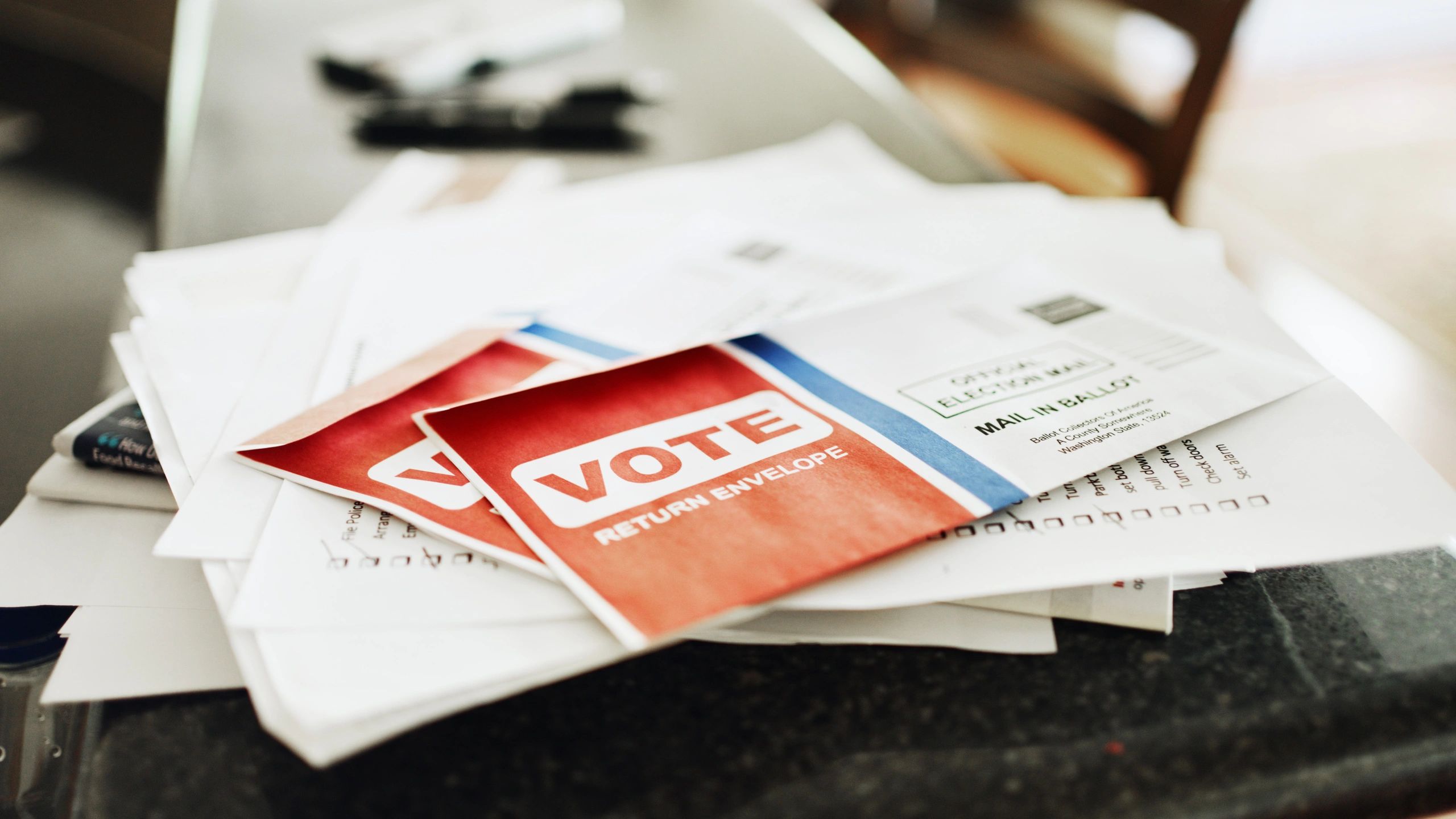 Mail-in voting ballots on a kitchen counter