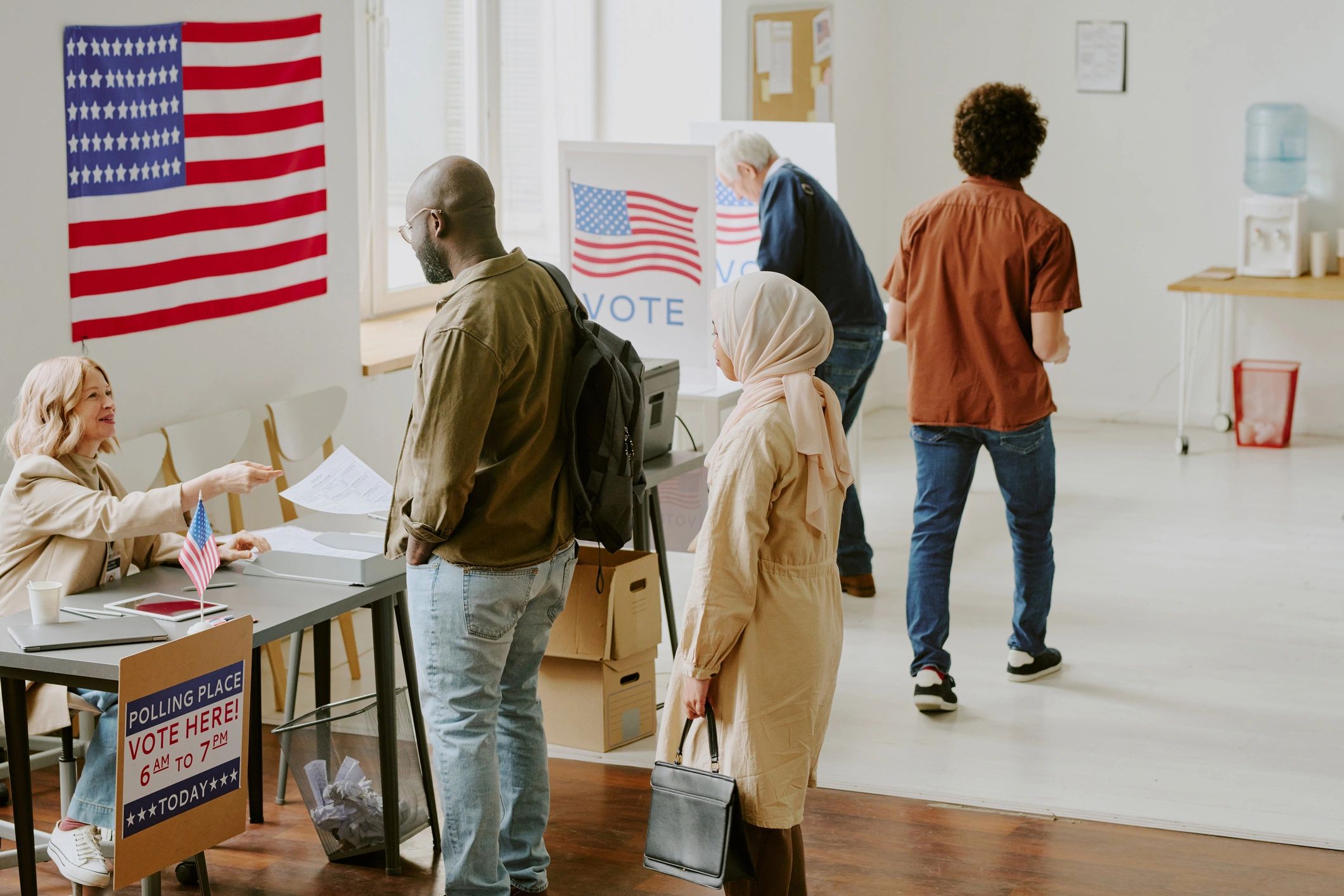 Voters participating at a polling station on election day