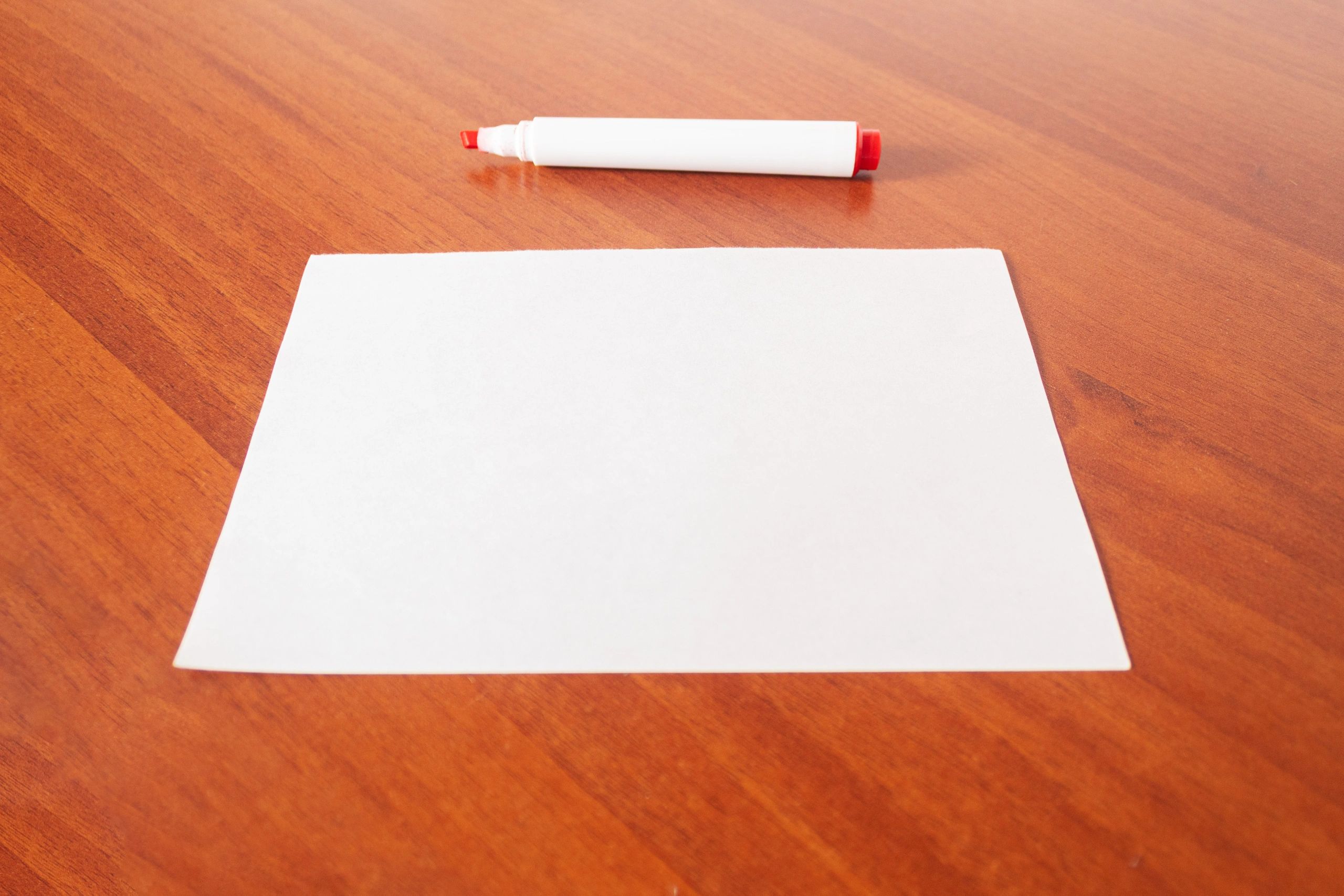 Blank page and marker representing ideas and sign-making